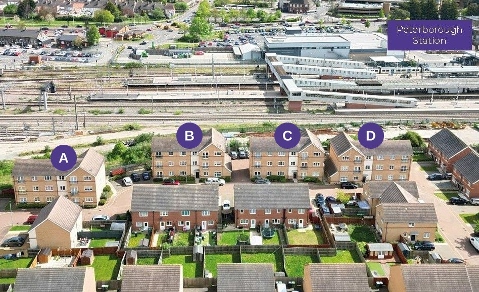 Blocks A to D of Rathbone Crescent with Peterborough station directly behind